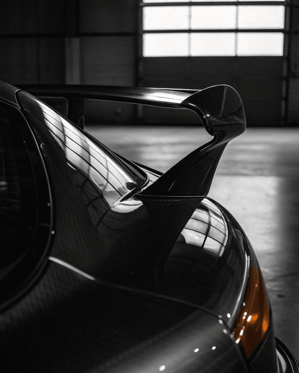 Tight crop of a Porsche 911 GT3 rear wing